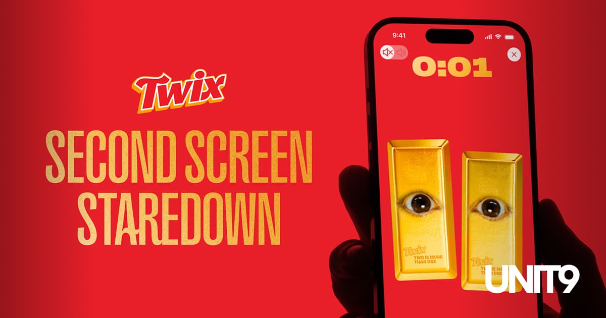 Twix Second Screen Staredown key visual: a phone showing two gold Twix bars with eyes